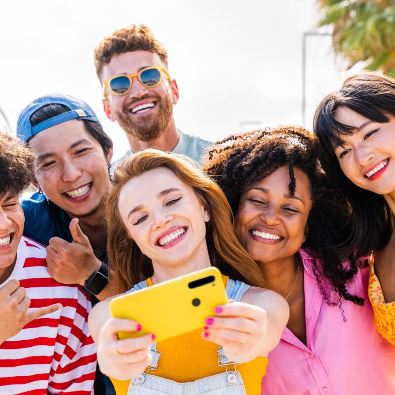 article banner featuring a group of friends taking a selfie on a phone