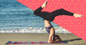 A woman on the beach doing a headstand to promote healthy lifestyle.