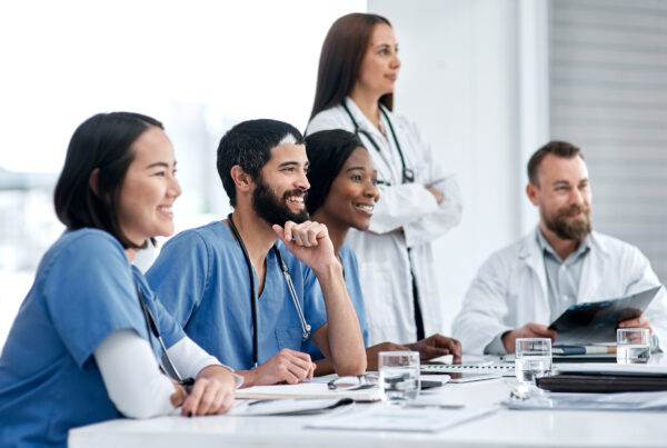 article banner featuring stock photo of a group of healthcare providers smiling