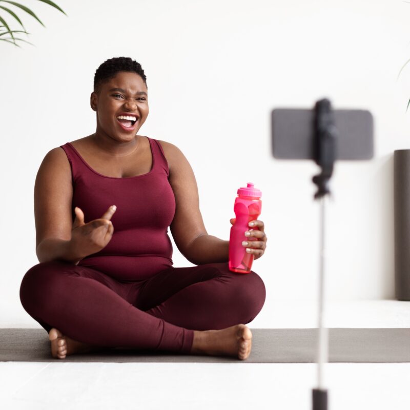 article banner featuring young woman in athleisure wear talking in front of a camera