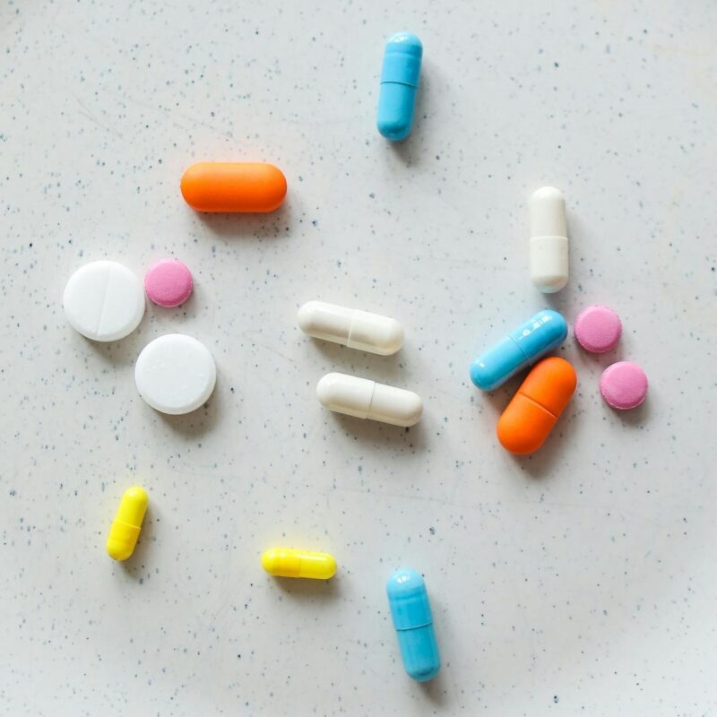 banner image featuring multicolored pills and medicine for the article Top Growth Marketing Strategies For Healthcare Brands in 2025