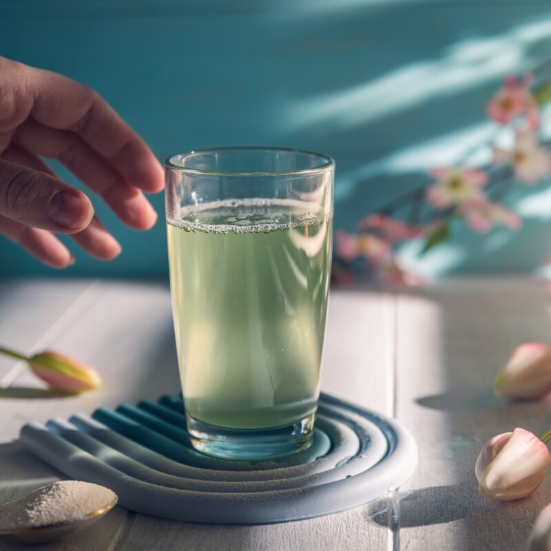 image of hand reaching for healthy beverage image for blog article From Performance to Purpose: Marketing Functional Beverages to Women